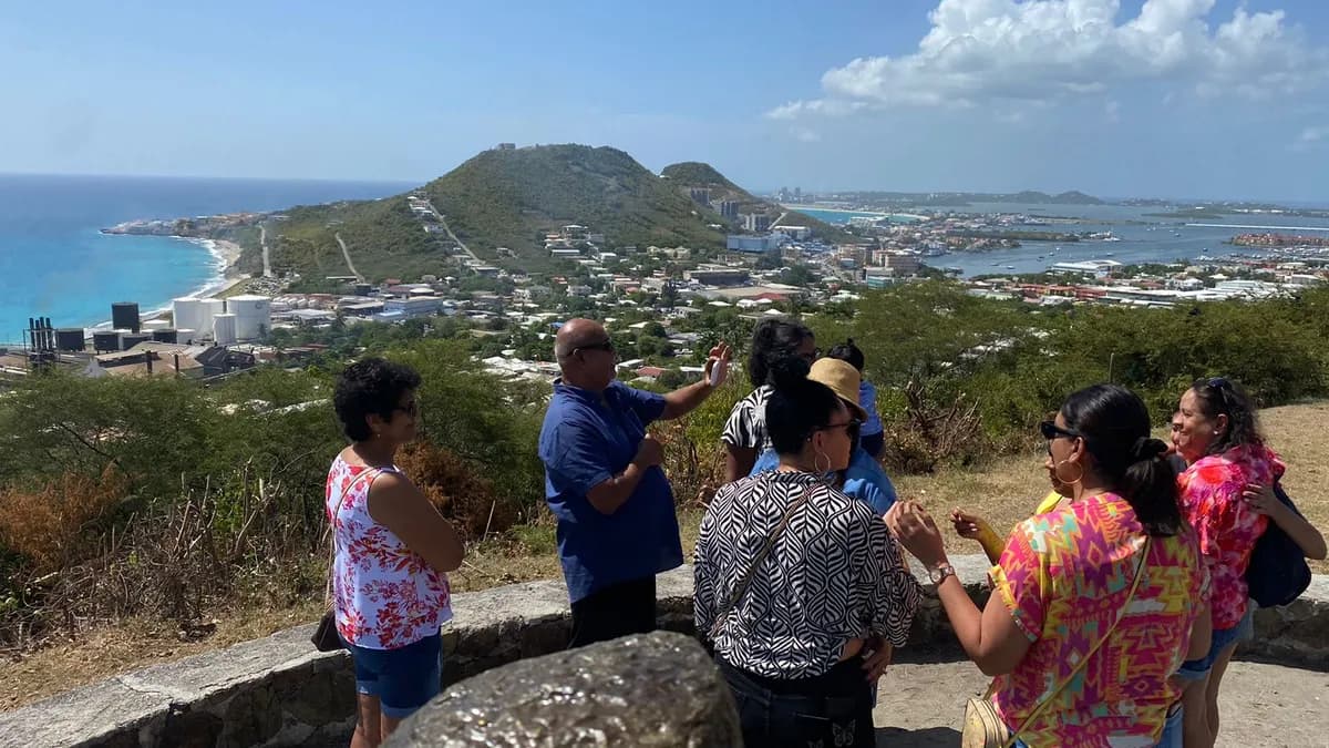 Tour guide explaining island history at a scenic viewpoint