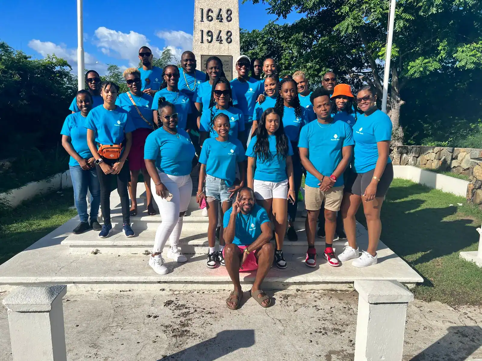 Confidence Tours team at the St. Maarten border monument